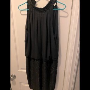 Cache size 12 black w/silver beading on lower part. Sleeveless mid length